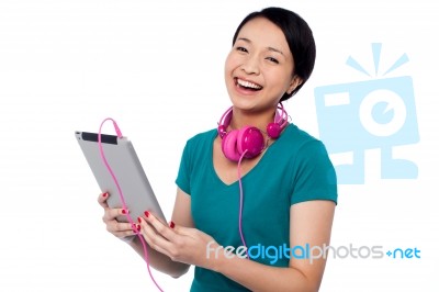 Girl Laughing Out Loud While Watching Funny Video Stock Photo