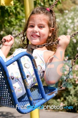 Girl On Swing Stock Photo