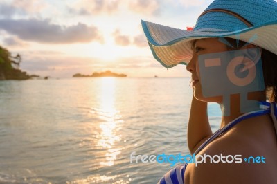 Girl On The Beach At Sunrise Stock Photo