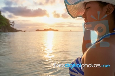 Girl On The Beach At Sunrise Stock Photo