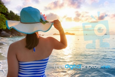 Girl On The Beach At Sunrise Stock Photo