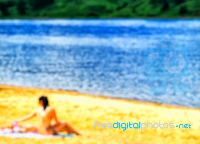 Girl On The Beach Composition Bokeh Stock Photo