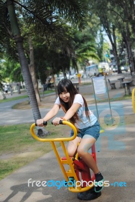 Girl Playing In Park Stock Photo