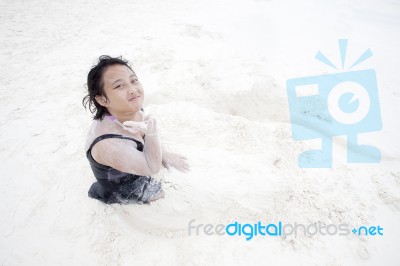 Girl Playing On Sand Beach Stock Photo