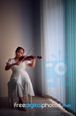 Girl Playing Violin Stock Photo