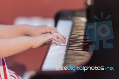 Girl Plays Piano Stock Photo