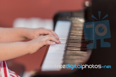 Girl Plays Piano Stock Photo