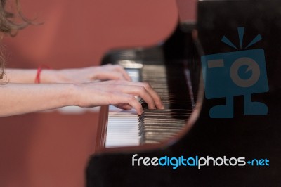 Girl Plays Piano Stock Photo