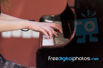 Girl Plays Piano Stock Photo