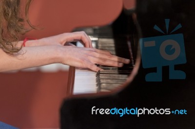 Girl Plays Piano Stock Photo