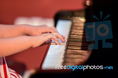 Girl Plays Piano Stock Photo