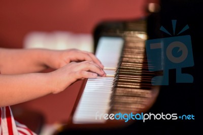 Girl Plays Piano Stock Photo