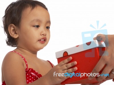 Girl Receiving Gift Stock Photo