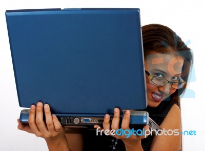 Girl Secretly Looking Behind Laptop Stock Photo