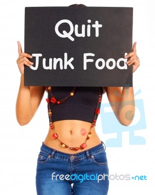 Girl Showing Quit Junk Food Board Stock Photo