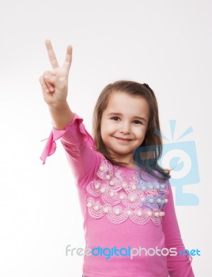 Girl Showing Victory Sign Stock Photo