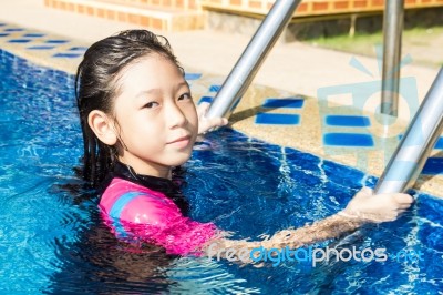 Girl Side Of Swimming Pool Stock Photo