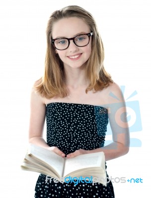 Girl Standing With Opened Book Stock Photo