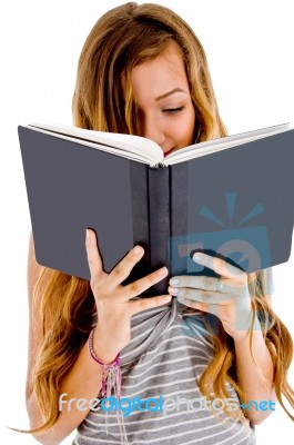 Girl Student Reading Her Notebook Stock Photo