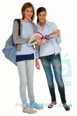 Girl Students Holding Books And Bag Stock Photo