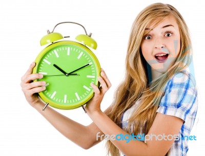 Girl Surprised With Alarm Clock Stock Photo