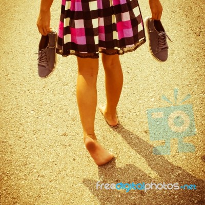 Girl Walking Barefoot On Asphalt Road,filters Images Stock Photo