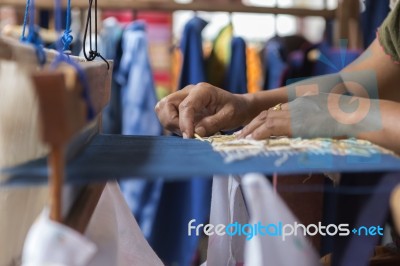 Girl Weaving Traditional Sarong Stock Photo