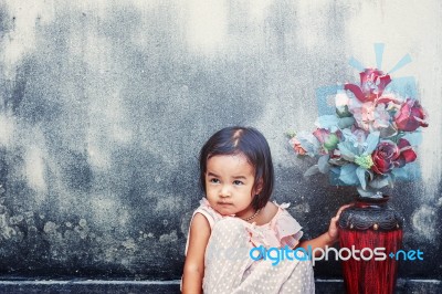 Girl With A Vase Of Flowers Stock Photo