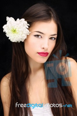 Girl With Flower In Her Hair Stock Photo