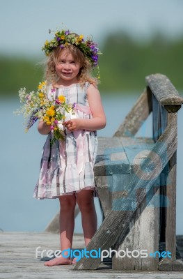 Girl With Flowers In Her Hair Stock Photo