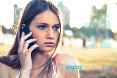 Girl With Smart Phone Near Beach Stock Photo