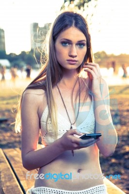 Girl With Smart Phone Near Beach Stock Photo