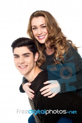 Girlfriend Enjoying Piggyback Ride Stock Photo