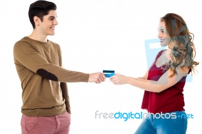 Girlfriend Sweetly Snatching Credit Card Stock Photo