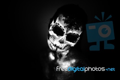 Girl's Face Painted Uv Skull Stock Photo