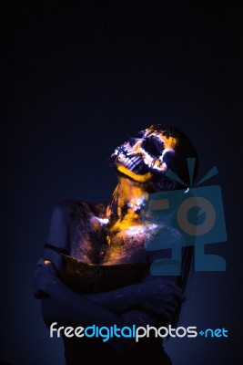 Girl's Face Painted Uv Skull Stock Photo