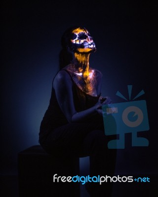 Girl's Face Painted Uv Skull Stock Photo