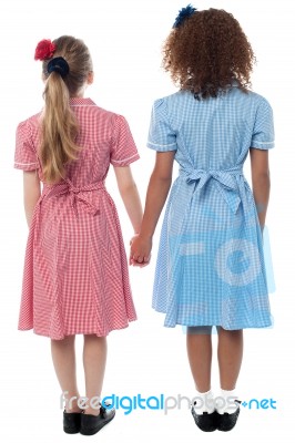 Girls In School Uniform Facing The Wall Stock Photo