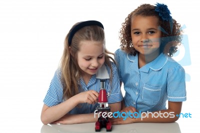 Girls Studying With Microscope Stock Photo