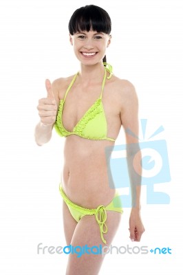 Glamorous Bikini Model Showing Thumbs Up Stock Photo