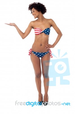 Glamorous Bikini Woman Presenting Copy Space Stock Photo