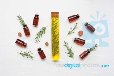 Glass Bottle Of Essential Oil  With Rosemary Stock Photo