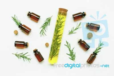 Glass Bottle Of Essential Oil  With Rosemary Stock Photo