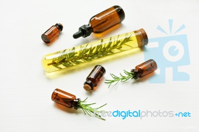 Glass Bottle Of Essential Oil  With Rosemary Stock Photo