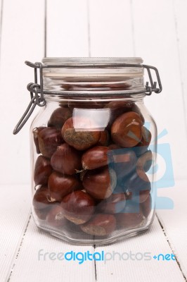 Glass Jar Full Of Chestnuts Stock Photo