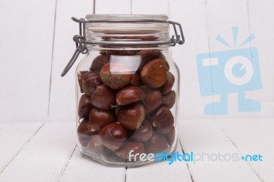 Glass Jar Full Of Chestnuts Stock Photo