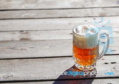 Glass Mug With Beer Standing On The Table Outdoor Stock Photo