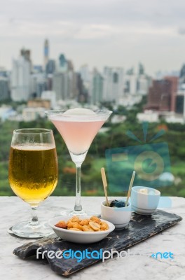 Glass Of Beer And Cocktail With Snack Stock Photo