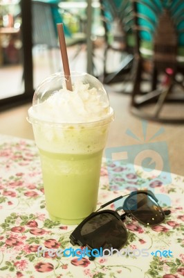 Glass Of Green Tea Latte Frappe Stock Photo