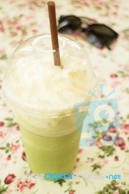 Glass Of Green Tea Latte Frappe Stock Photo